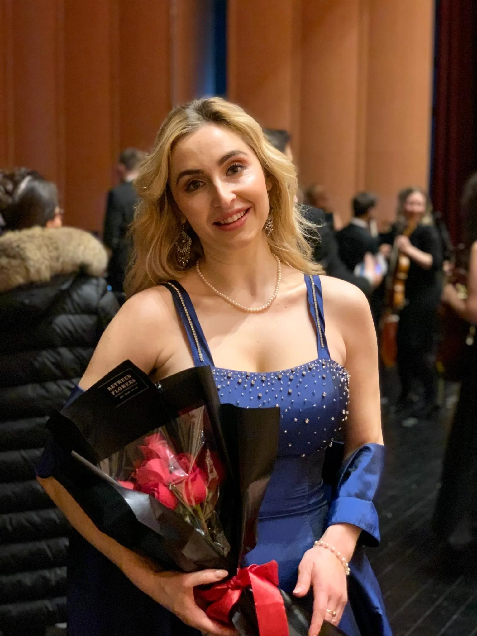 Venicia Rasmussen with flowers after a concert