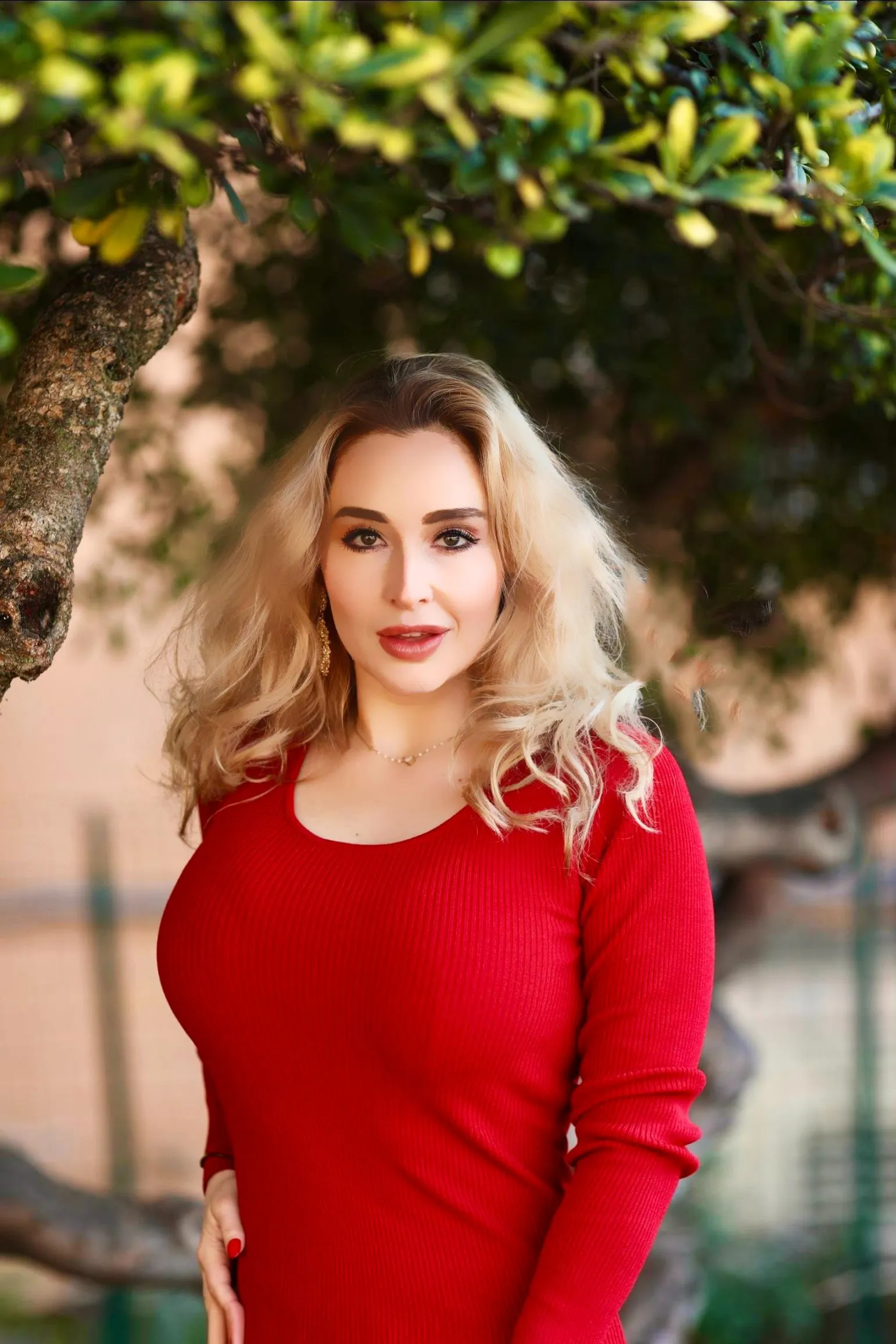 Venicia Rasmussen garden portrait in red